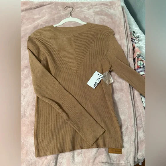 Nine West Tan Ribbed Sweater
Brand new with tags!
Size Large - Picture 3 of 9